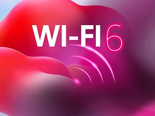Das Wort Wi-Fi und das Funksymbol vor buntem Hintergrund