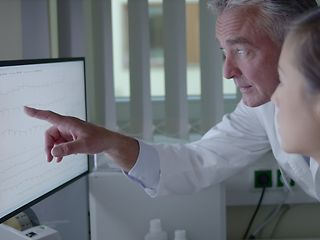 Medician looking at a screen